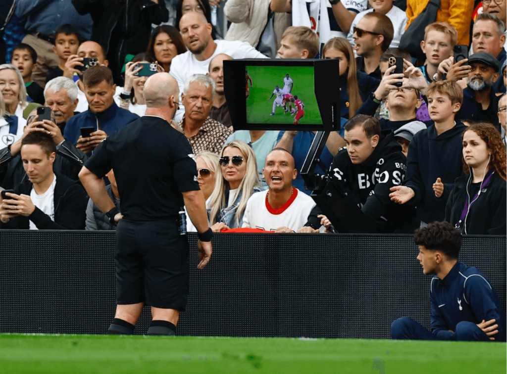 Simon Hooper looking at Curtis Jones red card using VAR technology